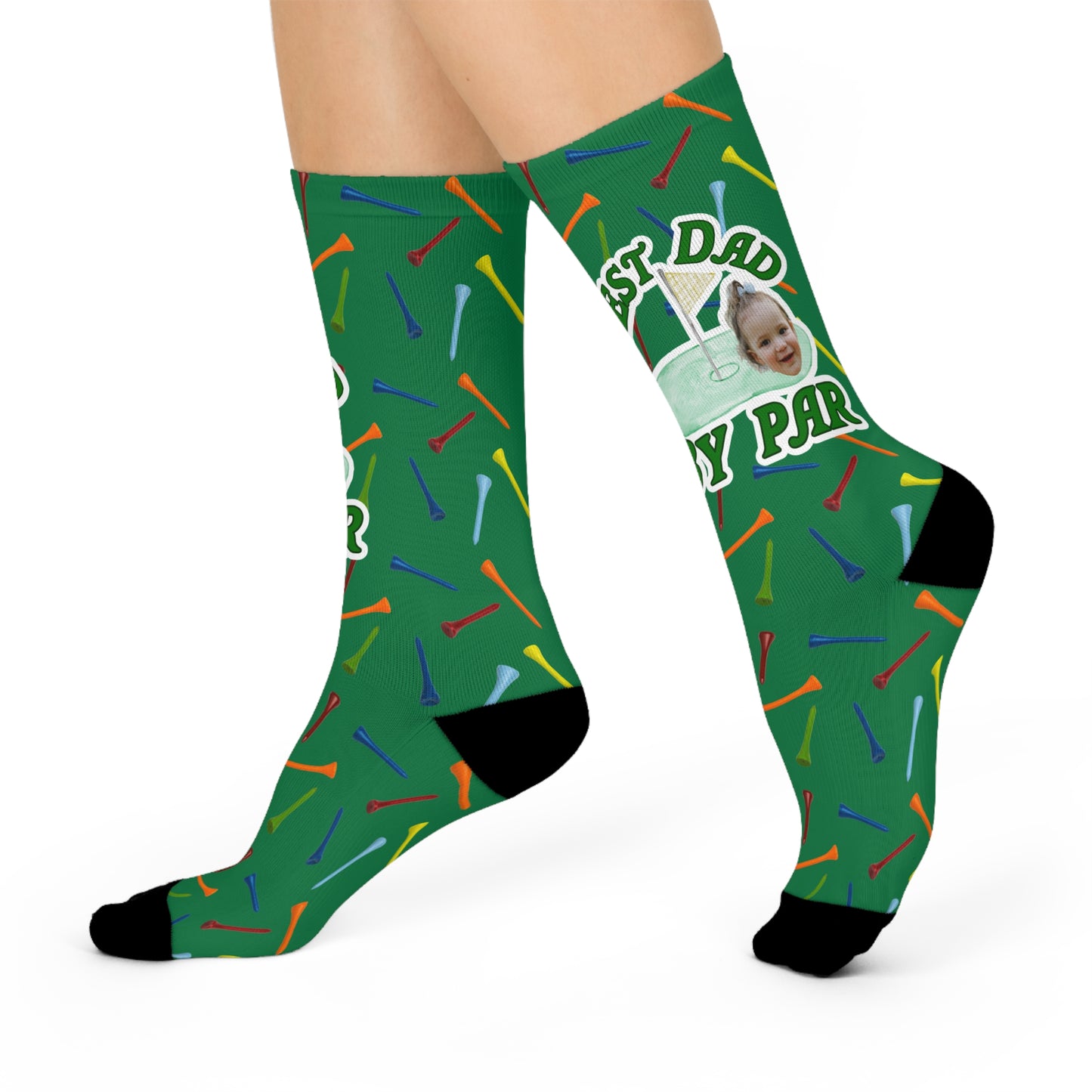 Multicolor tees on green with one large ‘hole in one’ design